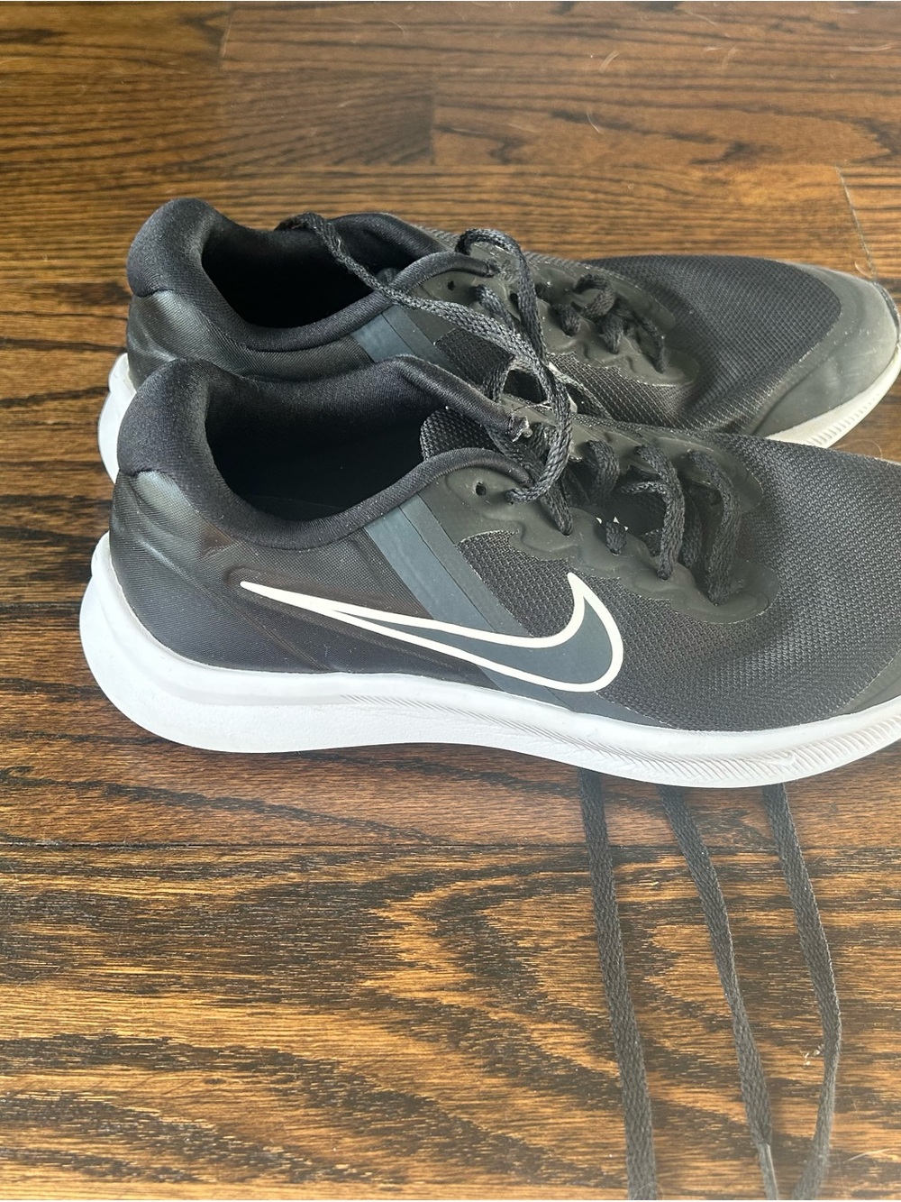 Nike youth Black and White Training/Running Sneakers